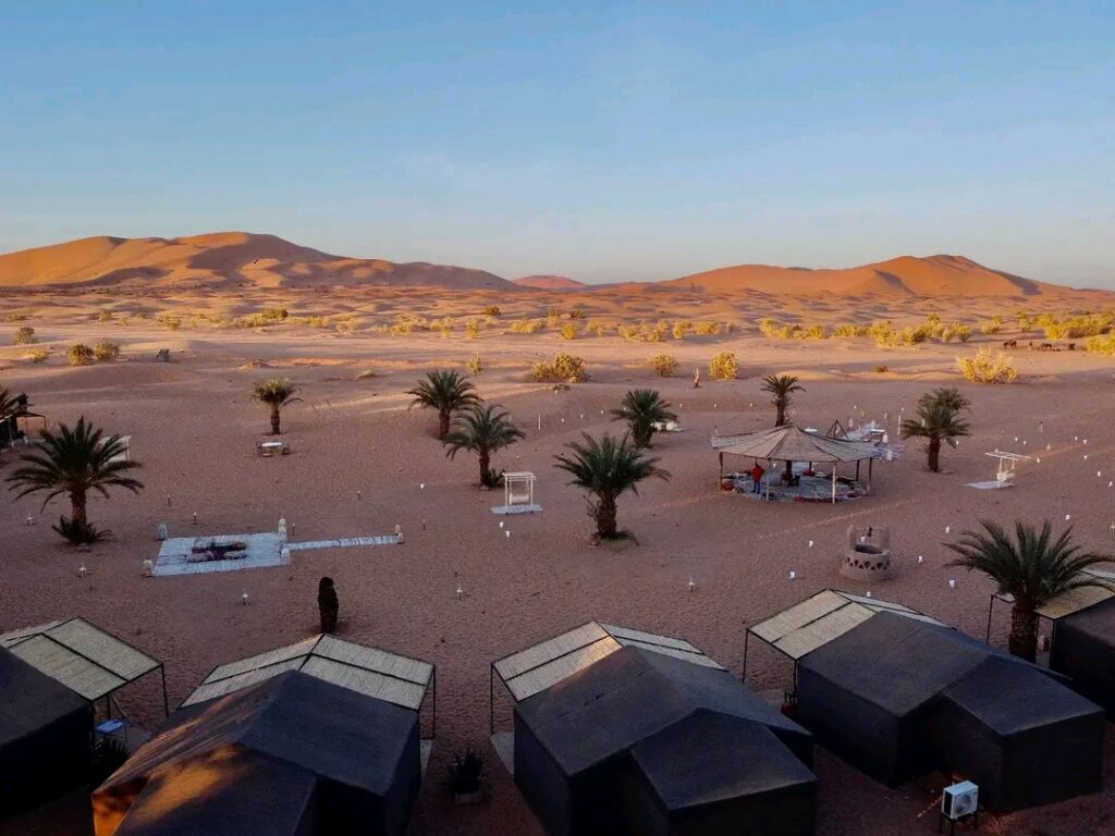 alt="the camp desert in the deep of the dunes of Merzouga desert"